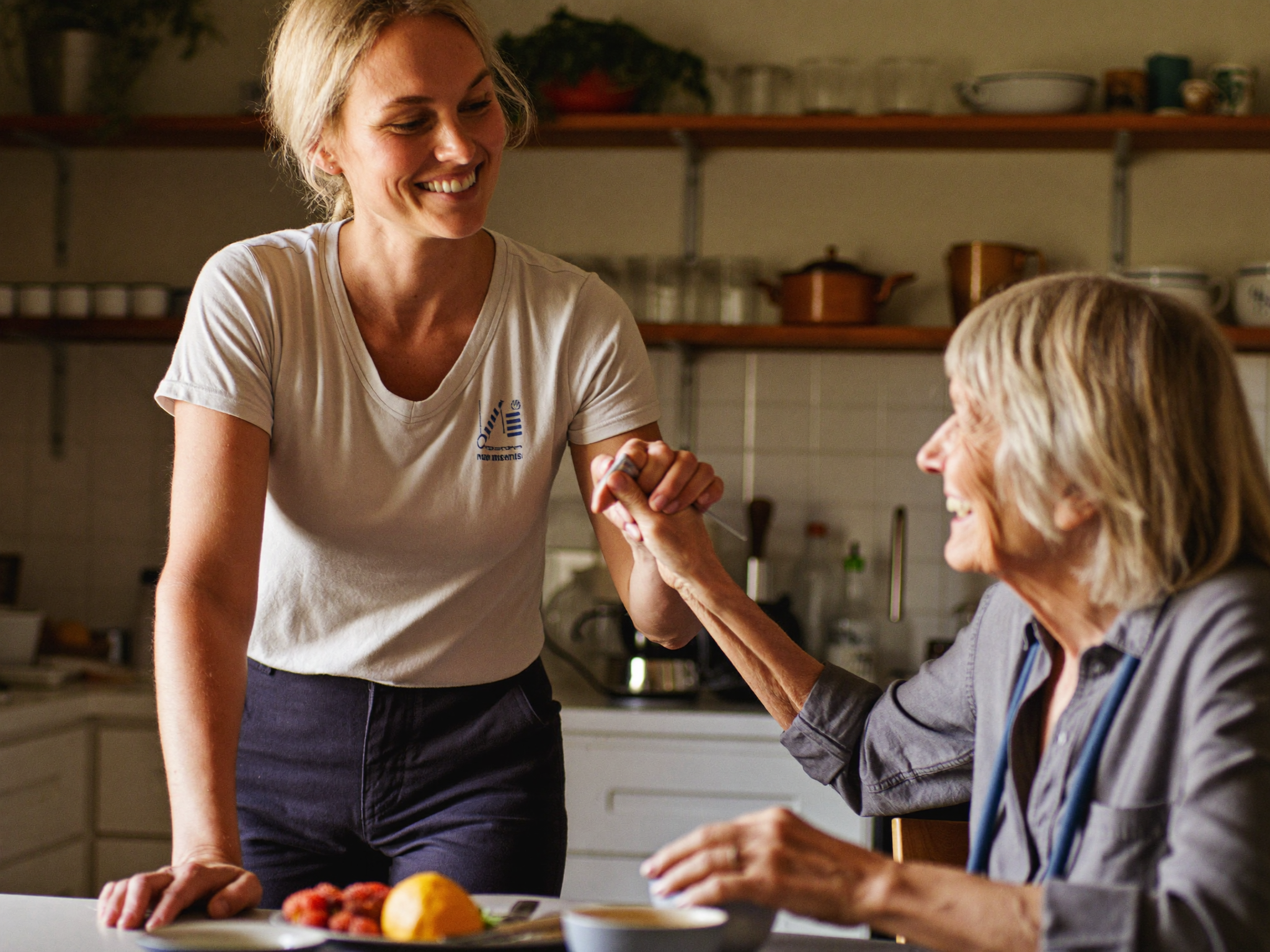 Support worker helping a participant at home